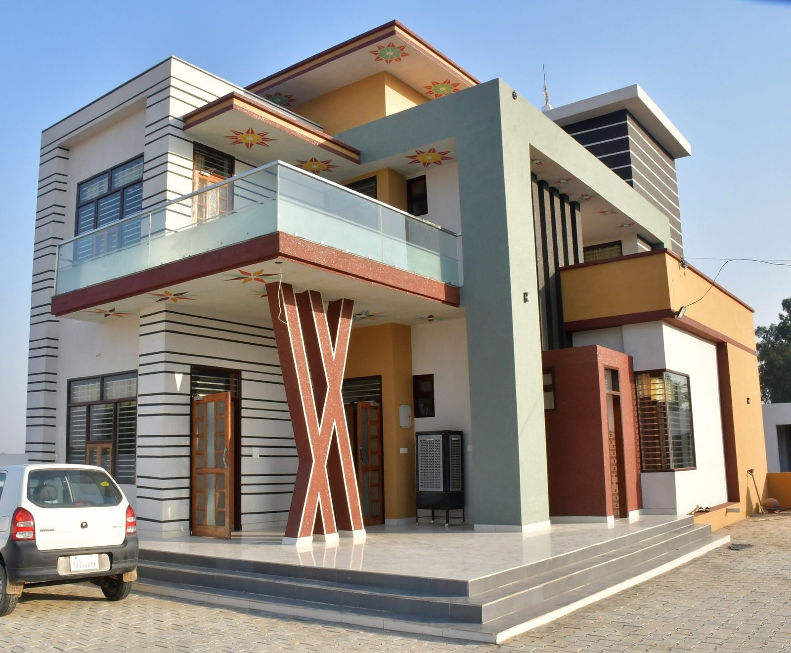 Madrasi Dana marble texture paint on a premium house exterior in Haryana