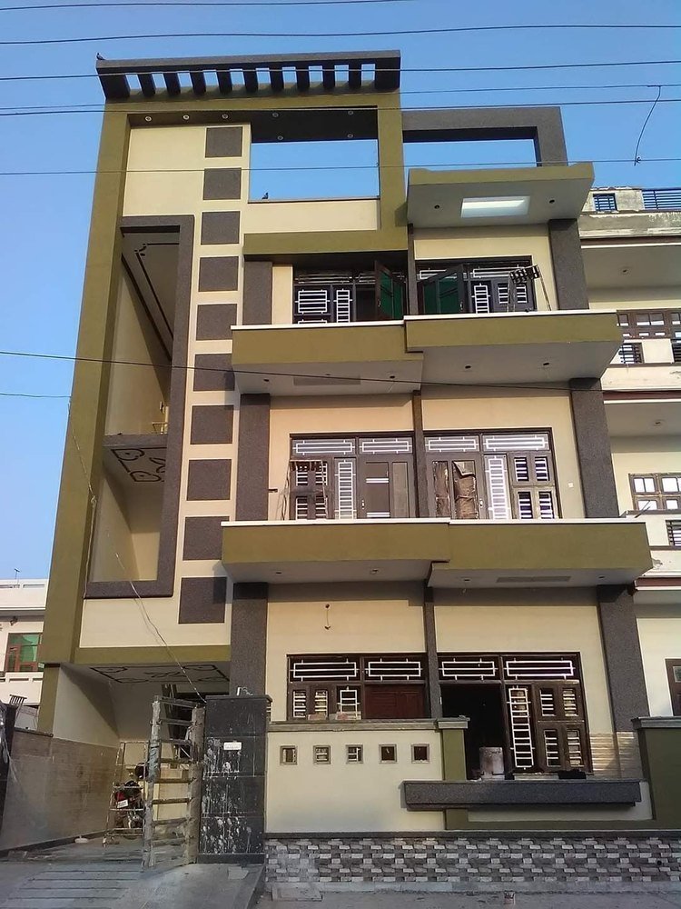 Modern 3-storey house with texture paint front
